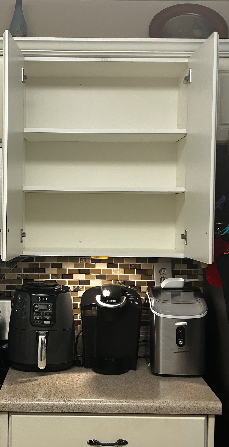 The kitchen cabinet space for the tenant . The air fryer, crushed ice maker and the coffee maker is available for the tenant.