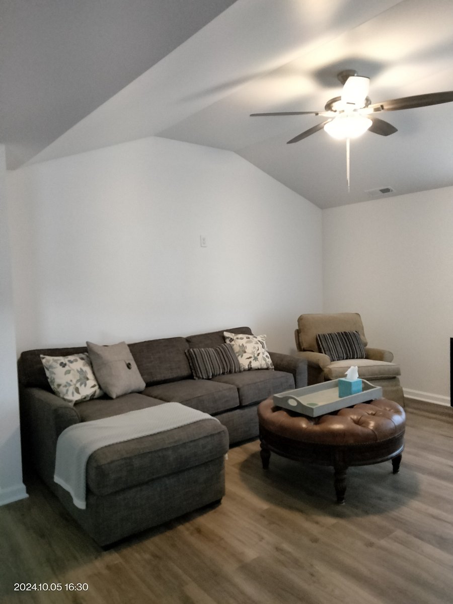 Living Room with TV across from sitting area.