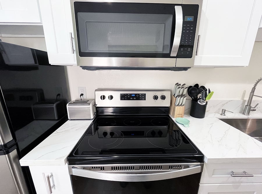 A microwave, toaster, and cooking utensils for you
