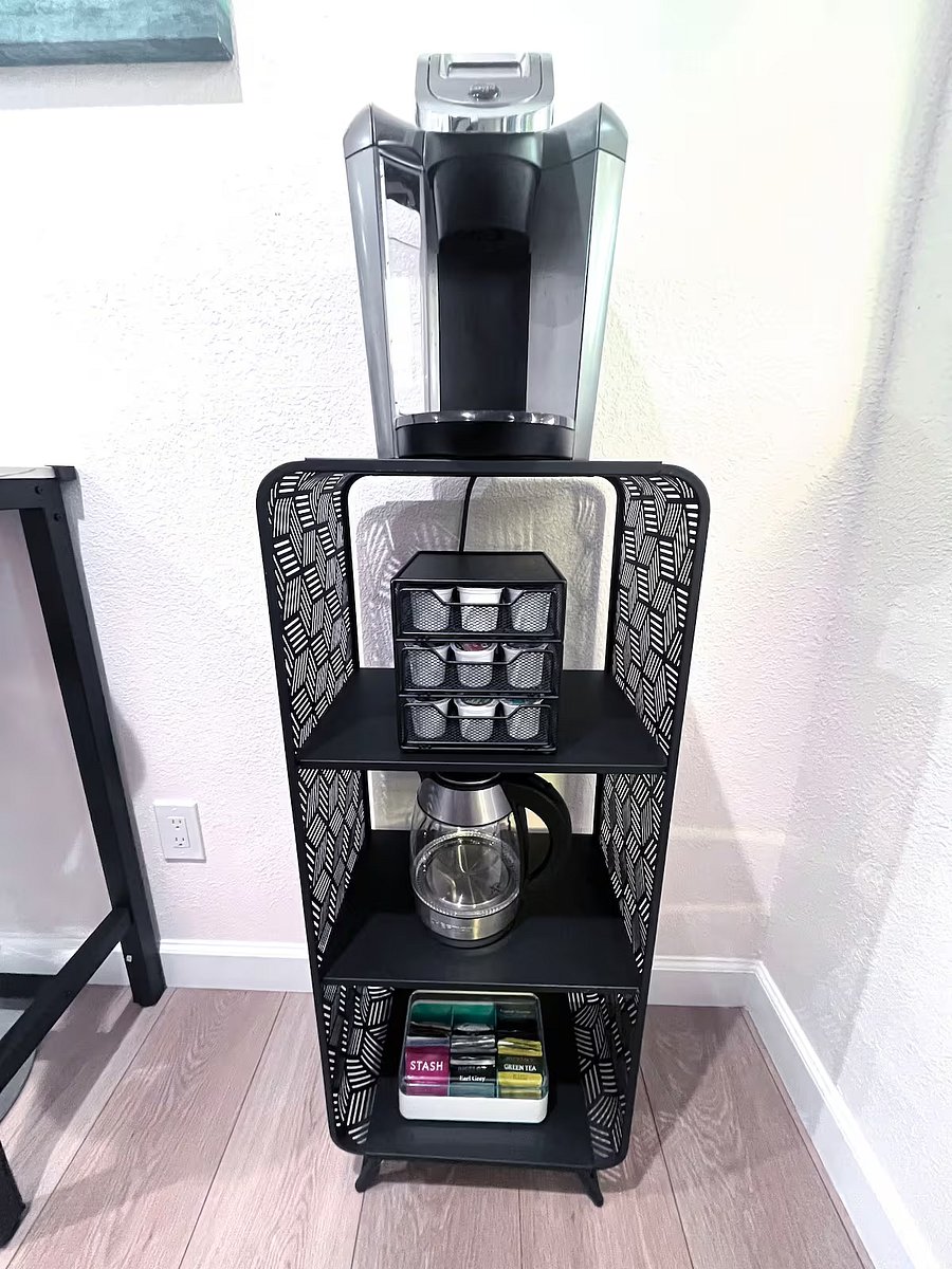 Enjoy the coffee and tea station, equipped with coffee pods, creamer, sugar, and tea bags.