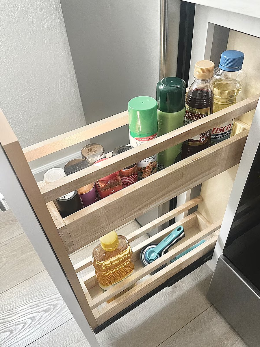 Cooking supplies are in the pull-out cabinet.