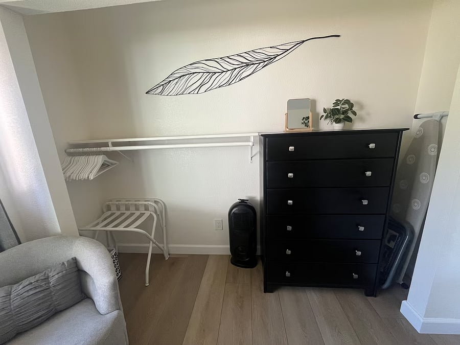 The bedroom is equipped with a dresser, luggage racks and clothes hangers for your convenience.