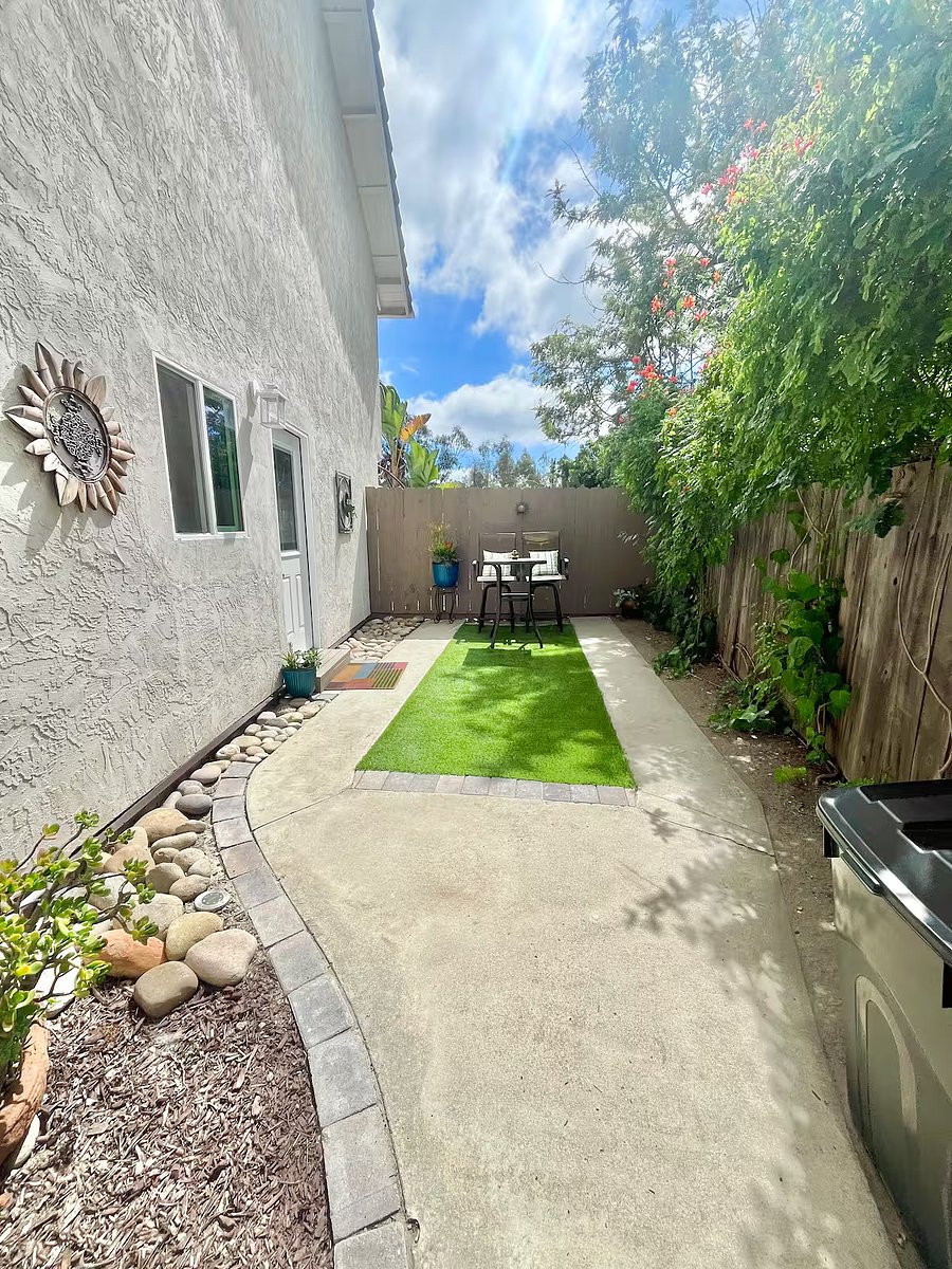 Once inside the gate, youll see the private fenced yard of the guesthouse.