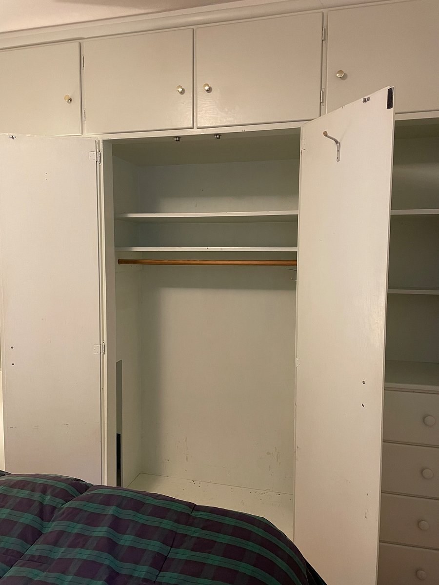 Small bedroom with built in closet and dresser