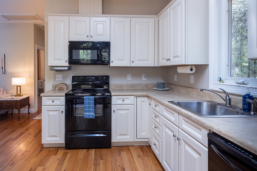 Full size kitchen supplied with basics needed. Mini-Keurig. Toaster. Sink has garbage disposal. Complimentary cleaning supplies will be stored under sink.