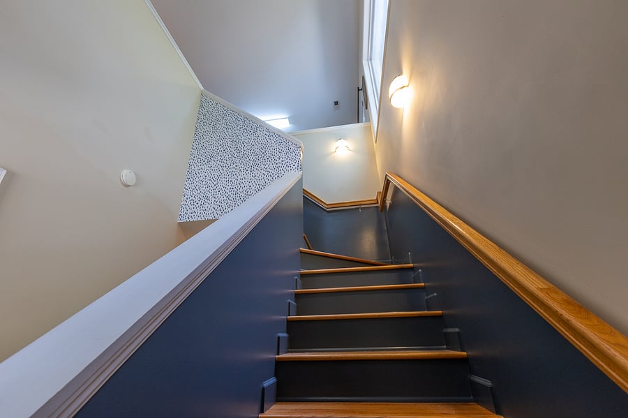 Stairs to upstairs living space. Secure, strong handrails all the way up.
