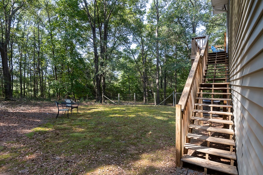 Fenced backyard. Easy walking stairs. A gate can be installed at top of stairs, if requested for safety of young children.