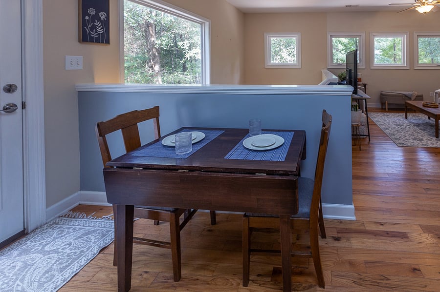 Table can be opened on either side to accommodate 4 seats. 2 additional seats located in the bedrooms.