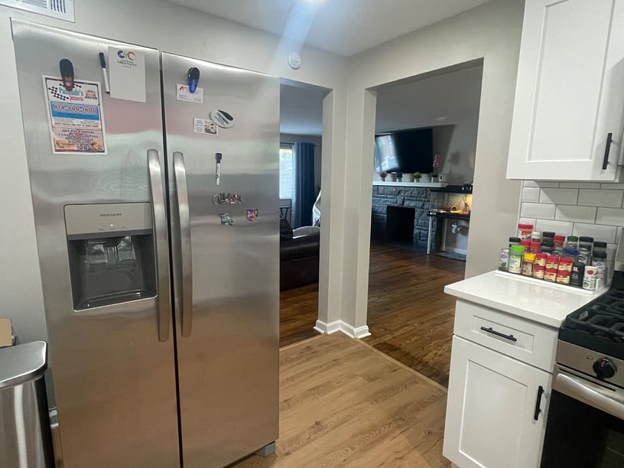 Kitchen with openings to dining and living rooms
