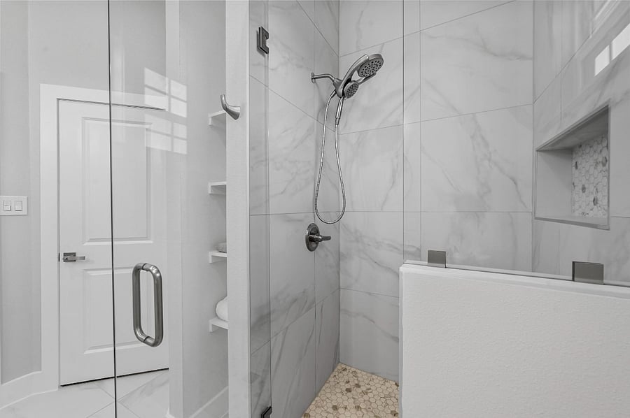 Primary Bedroom features private bathroom with 2 sinks, shower and full size walk-in closet.
