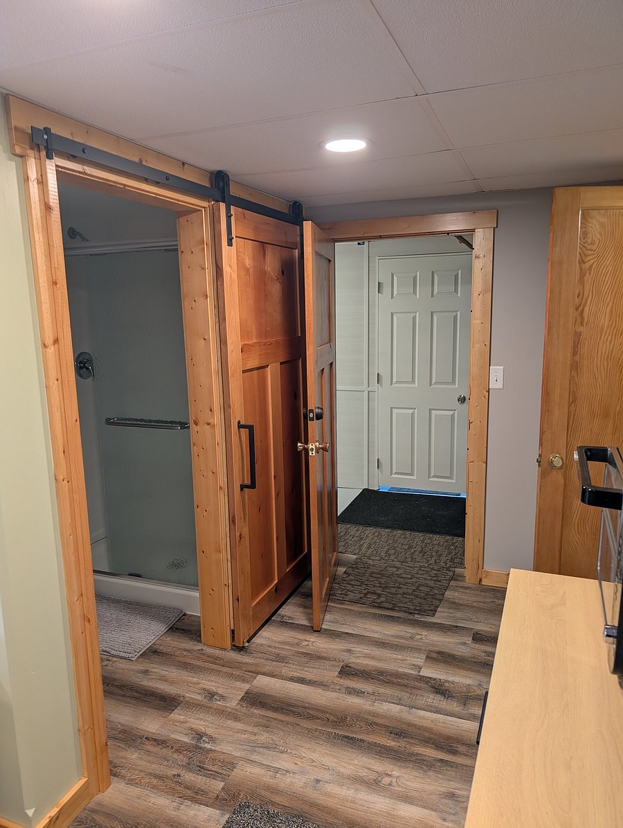 Adjacent to Laundry Room as well as private area for kitchen sink and dish wash area.