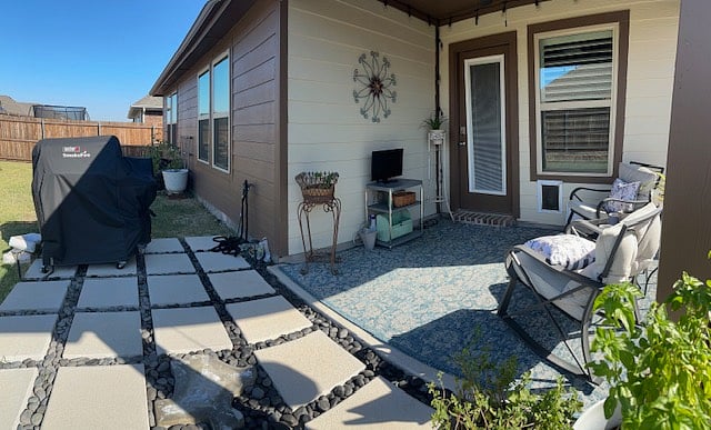Back patio with smoker/griller BBQ and rocking chairs