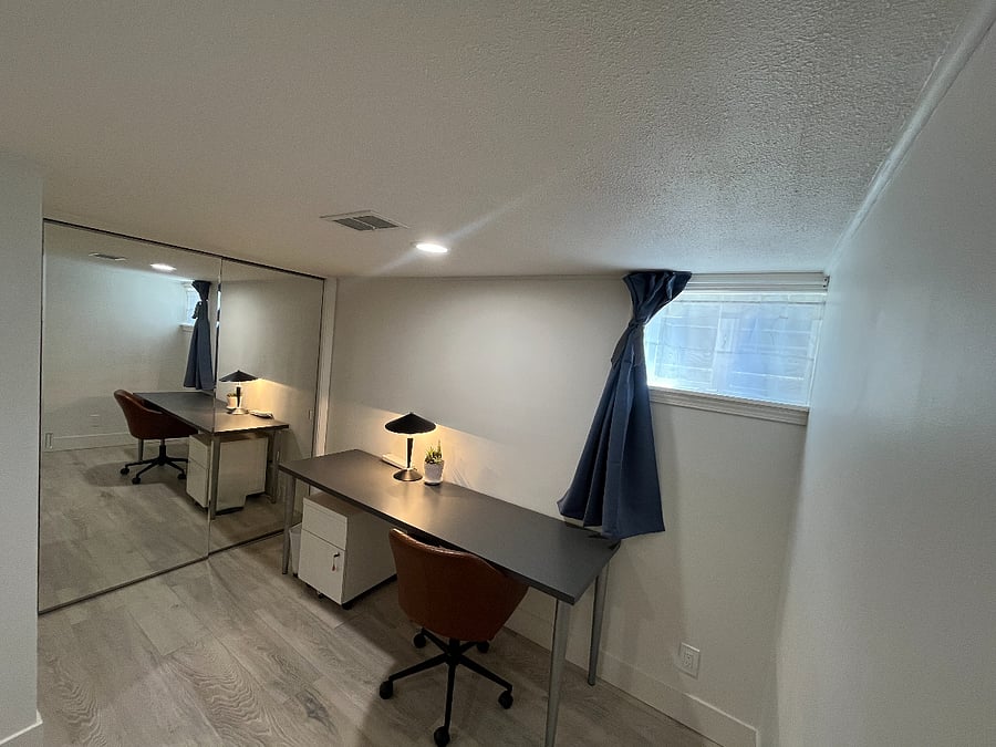 Bedroom two with large mirrored closet.