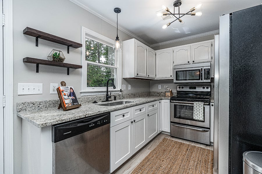 Kitchen with granite countertops and stainless steel appliances