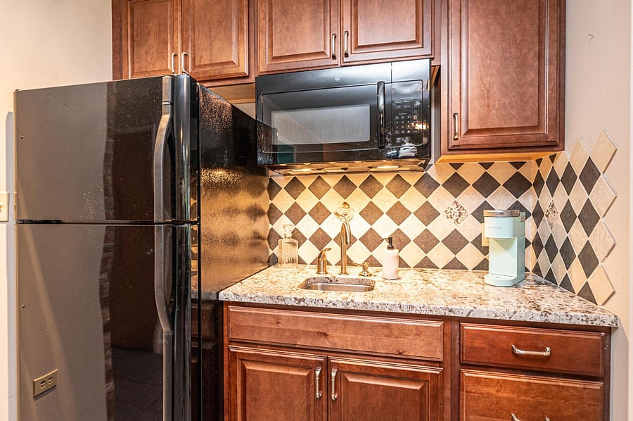 Refrigerator-Freezer, Sink, and Microwave Oven