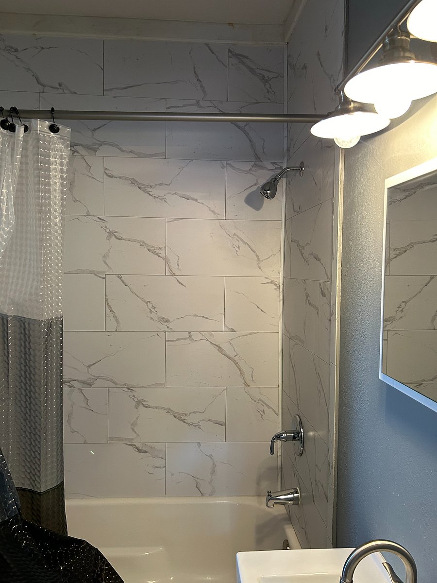 full bath with a bath tub