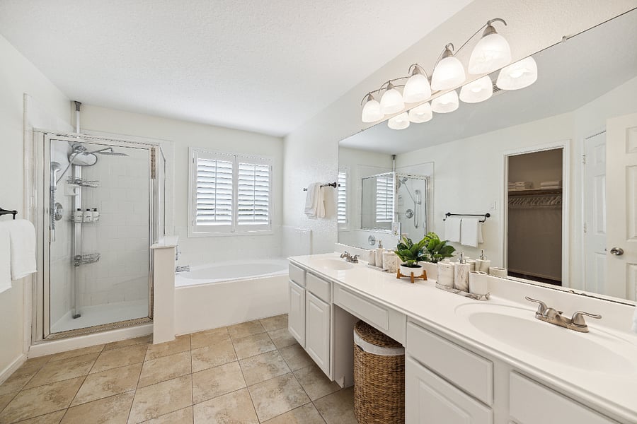 Enjoy a spacious master bathroom with double vanity, large mirror and walk-in closet