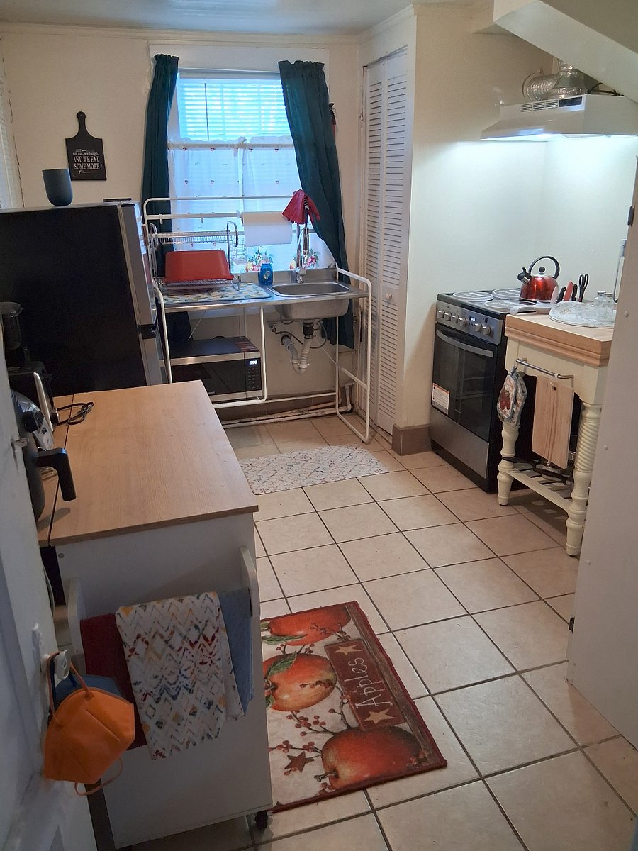 Kitchen with cookware, utensils and small appliances