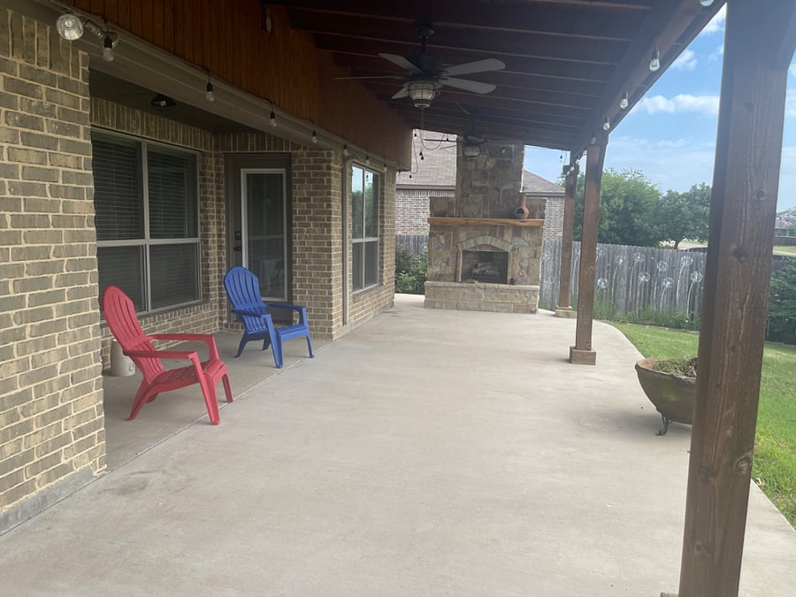 Covered Back Patio with Fireplace and BBQ Grill.