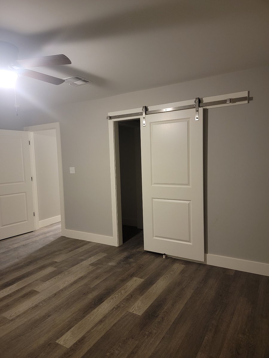 Main bedroom barn door entry to main closet/bathroom area