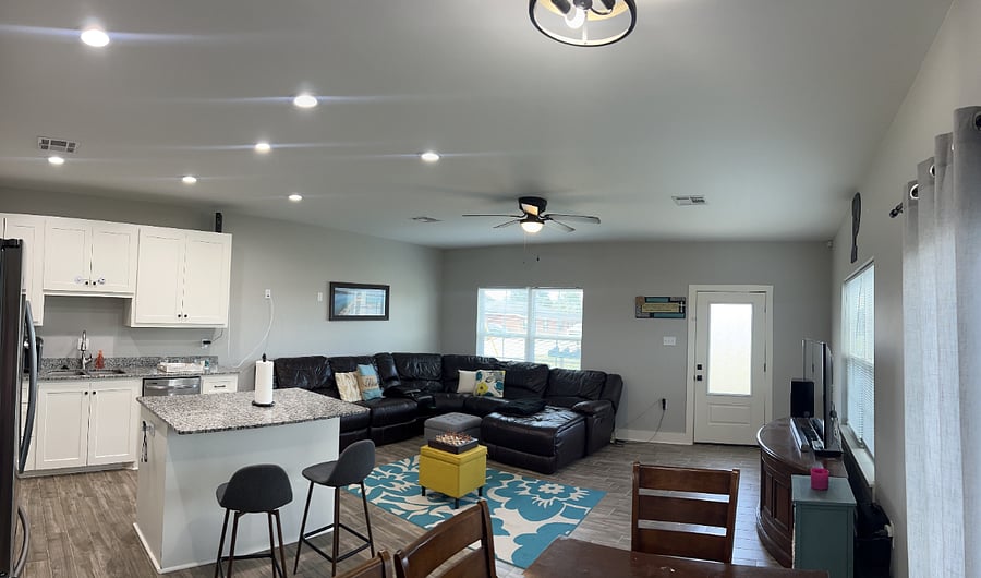 living room, kitchen and dining room. very large space