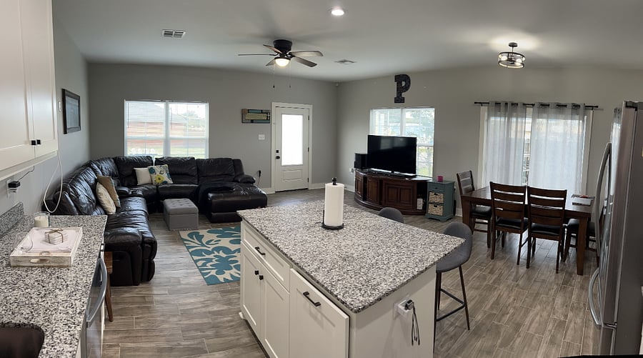 living room, kitchen and dining room. very large space