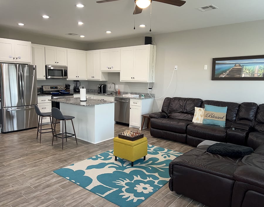 living room, kitchen and dining room. very large space
