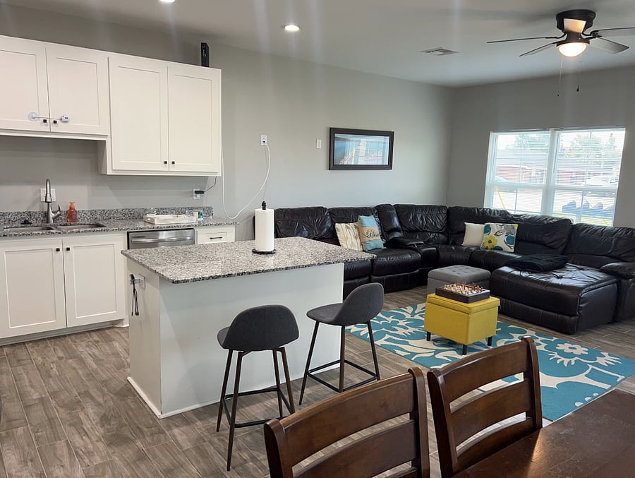 living room, kitchen and dining room. very large space