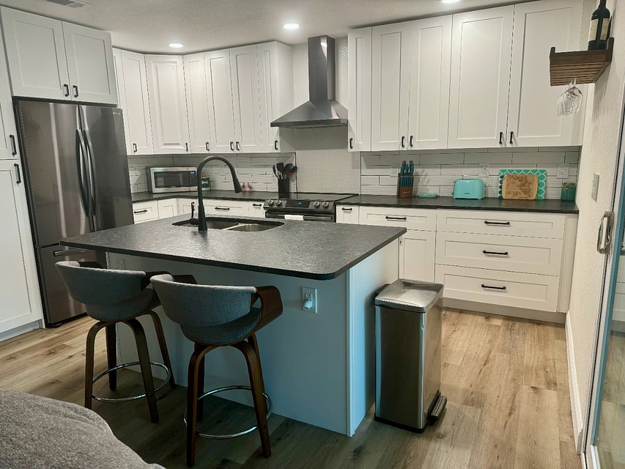 Renovated Kitchen with Leather Granite Countertops & Stainless Steel Appliances