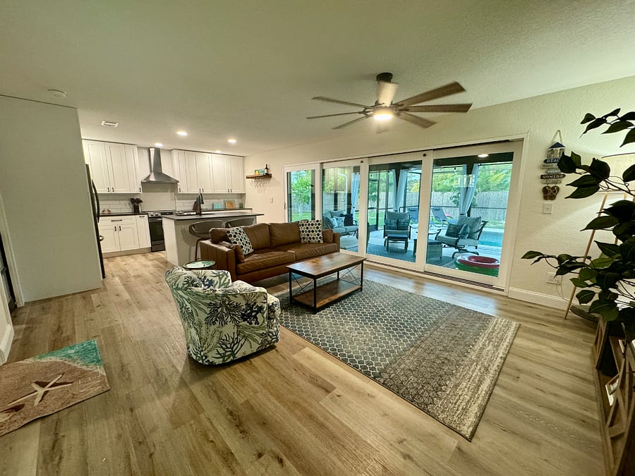 Open Layout and Large Sliders Providing Natural Light & Views of the Pool Area