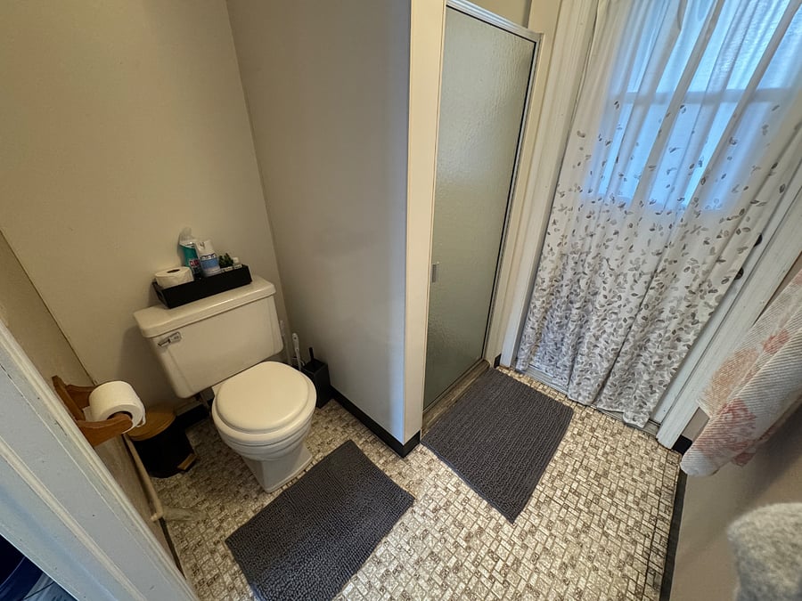 Shower and toilet in garage area. Nice for rinsing off after the beach.