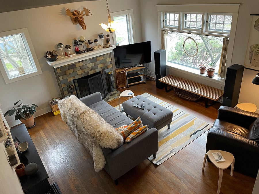 View from 2nd floor stairs to Main floor living room/ front door entrance