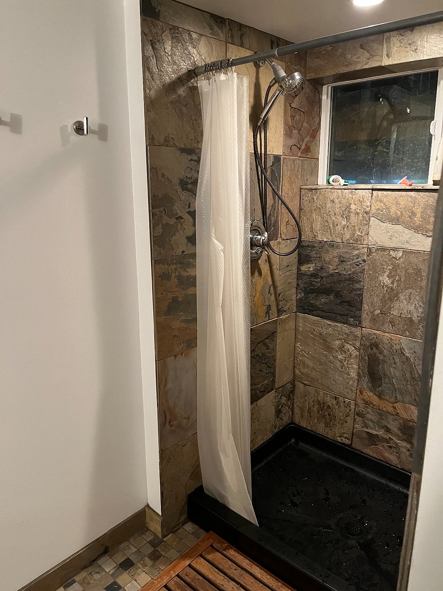 Basement level slate tile bathroom