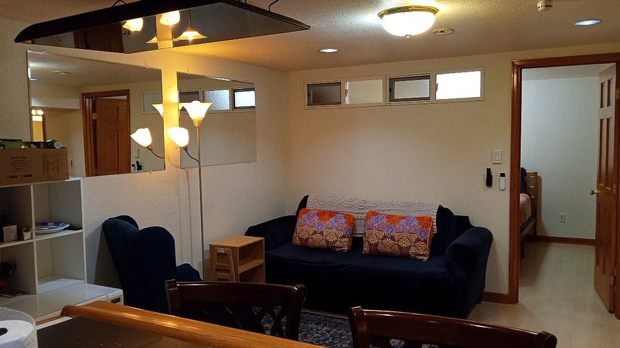 Comfy living area with 50" TV that goes up and down at the push of a button to save space.
