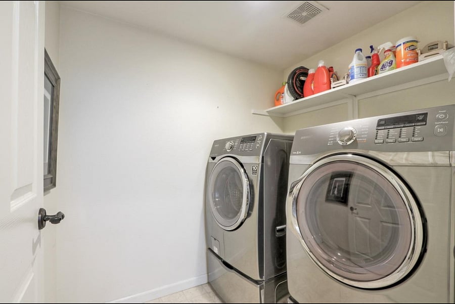 Laundry Room includes washer, dryer and storage