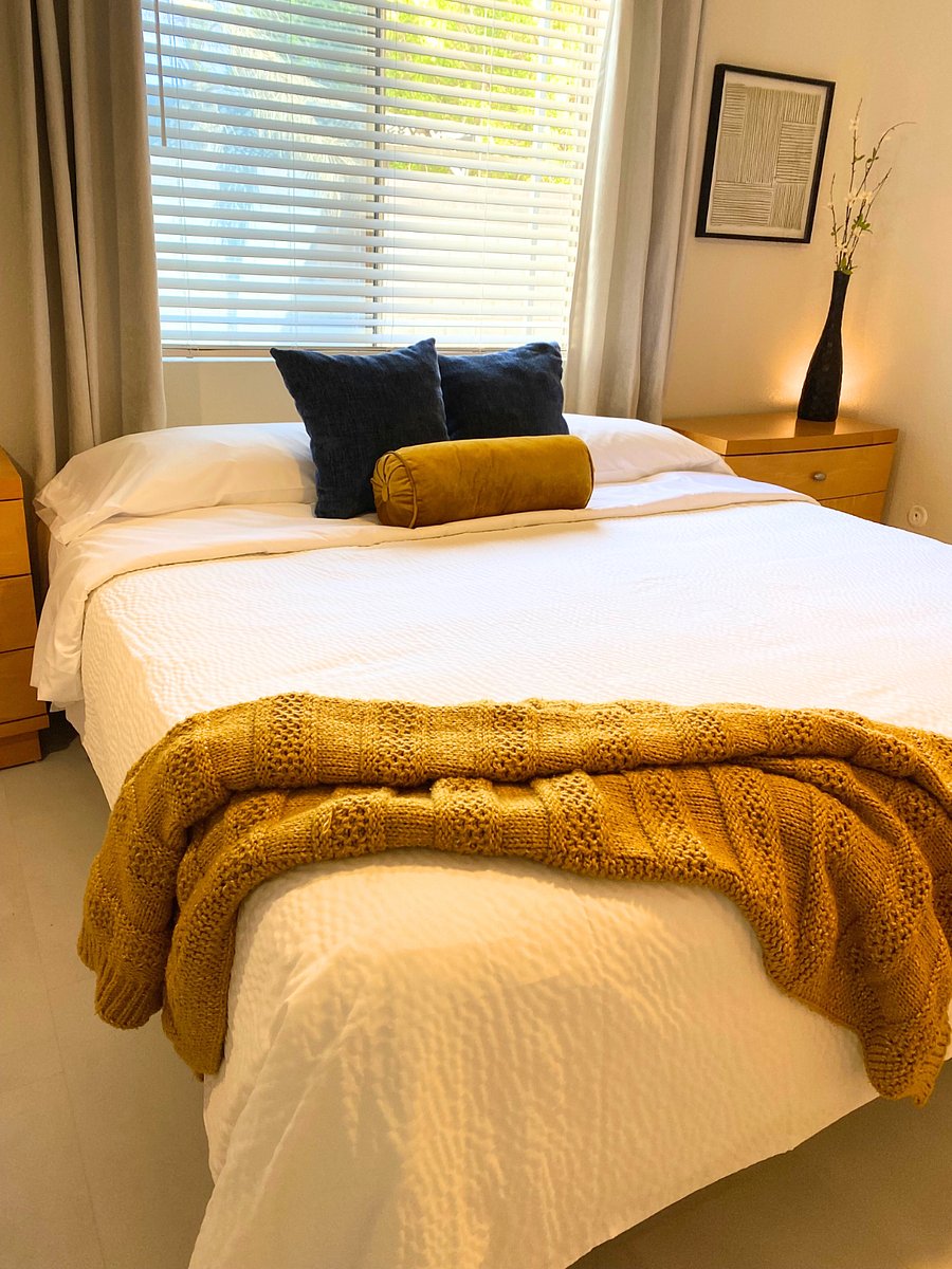 Spacious master bedroom with King size bed and private walk-in shower.