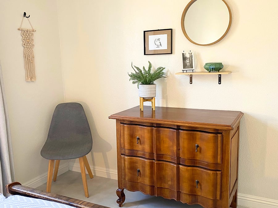 Bedroom 2 with chair, dresser & mirror.