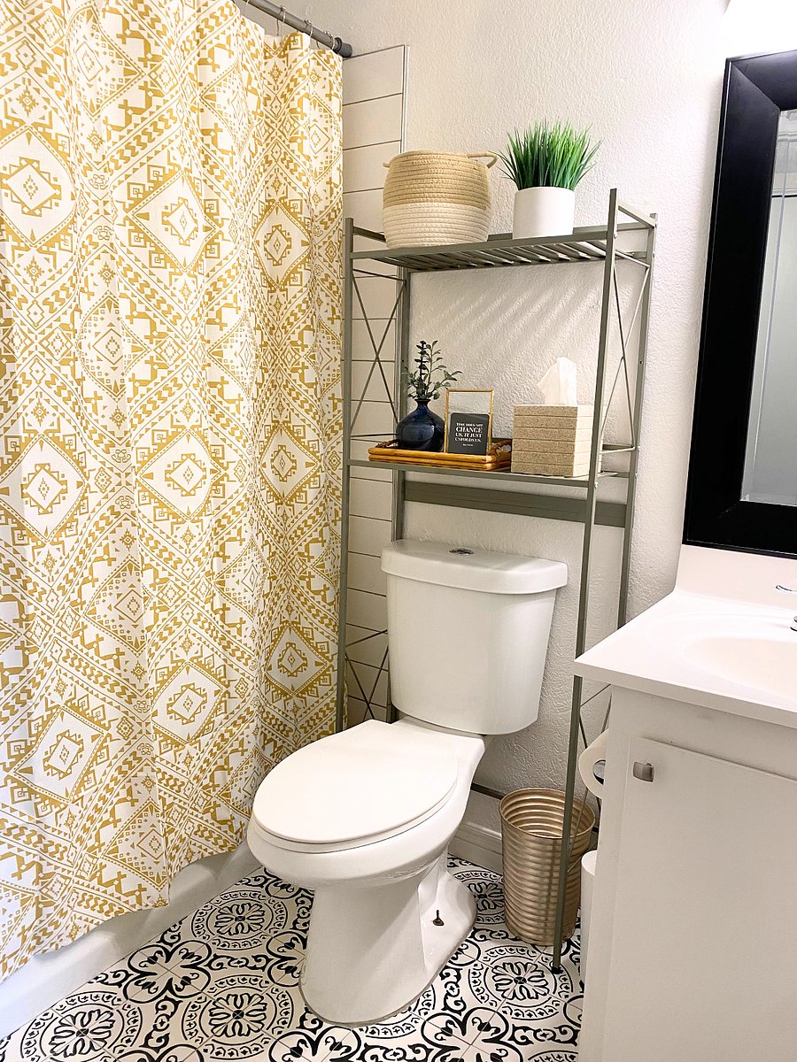 Hall bathroom (tub) and space saving storage rack.
