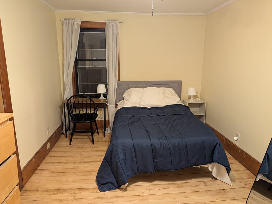Double bed with brand-new bedding. Each of the windows in the bedroom has blinds.