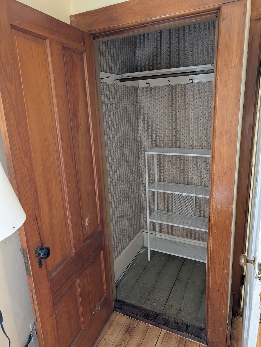 Master bedroom closet with shelving.