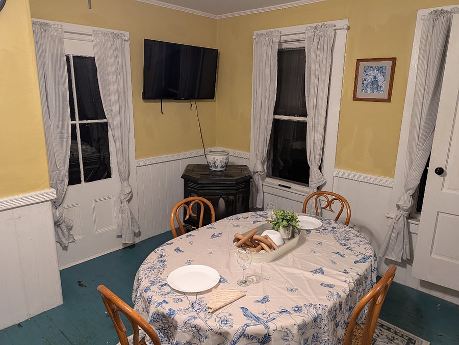 The dining area gets a lot of light during the day (sorry these pictures were taken at night) and includes a 47" TV.