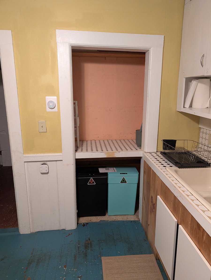 Pantry area. There is drawer storage on the left side (it's hard to see) and extra tiling so it can be used as an extra counter if necessary.