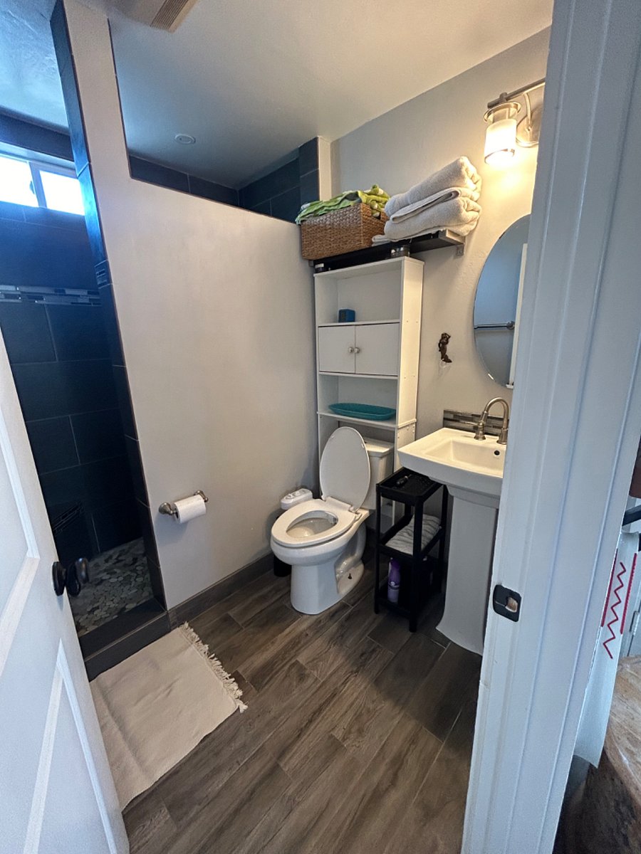 Full bathroom with walk in shower.