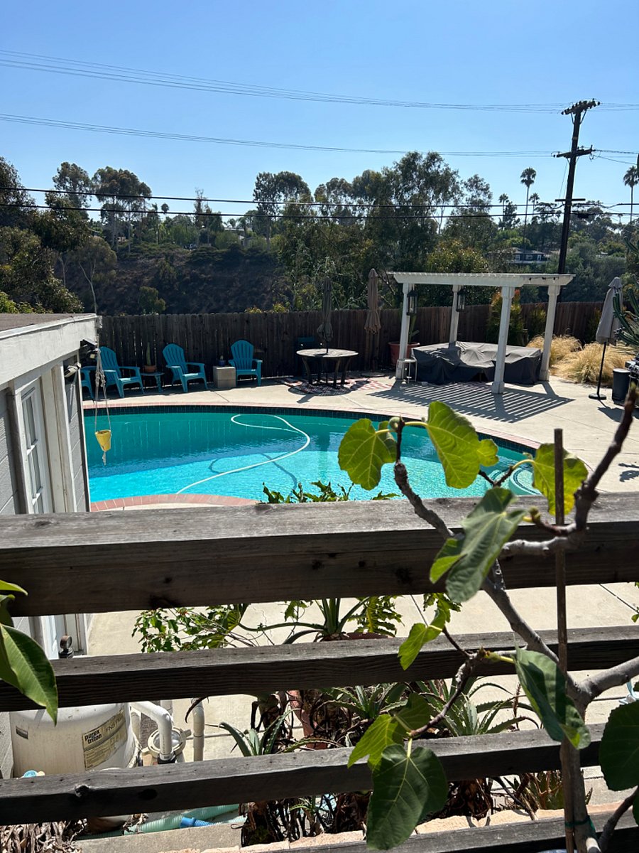 Laundry building seen left of pool. Private.