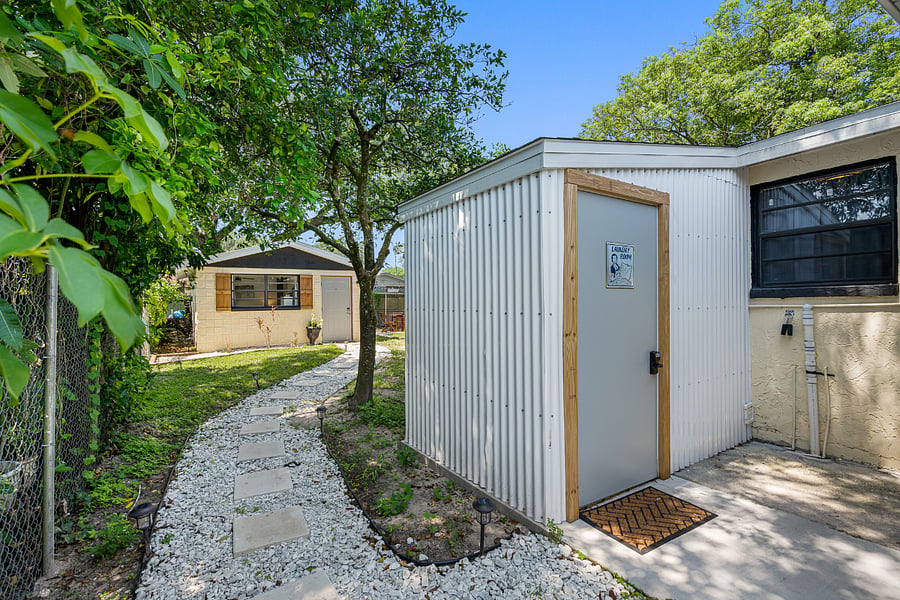 You'll pass the main house and the laundry room on the path to tiny home.