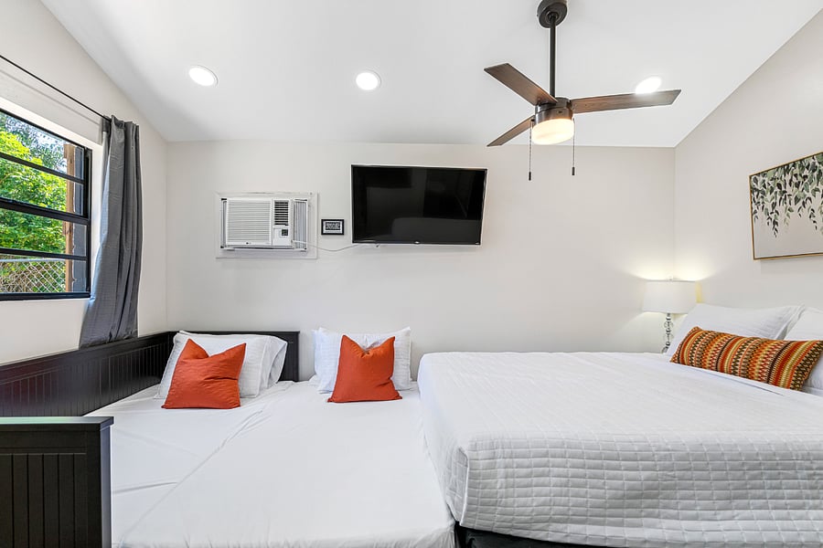 The day bed pulls out, but the walking space between beds is lost.