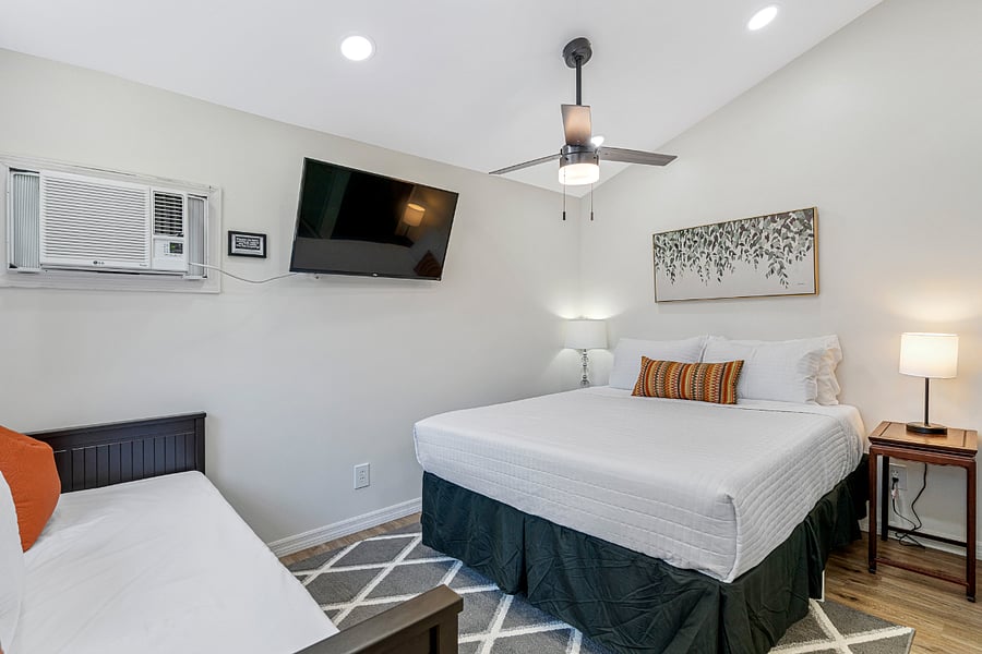 The tiny home sleeps three comfortably with a queen bed and daybed.