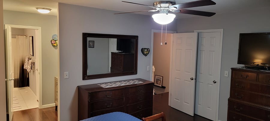 Master Bedroom - Dresser, hallway with washer/dryer, stairs to first floor