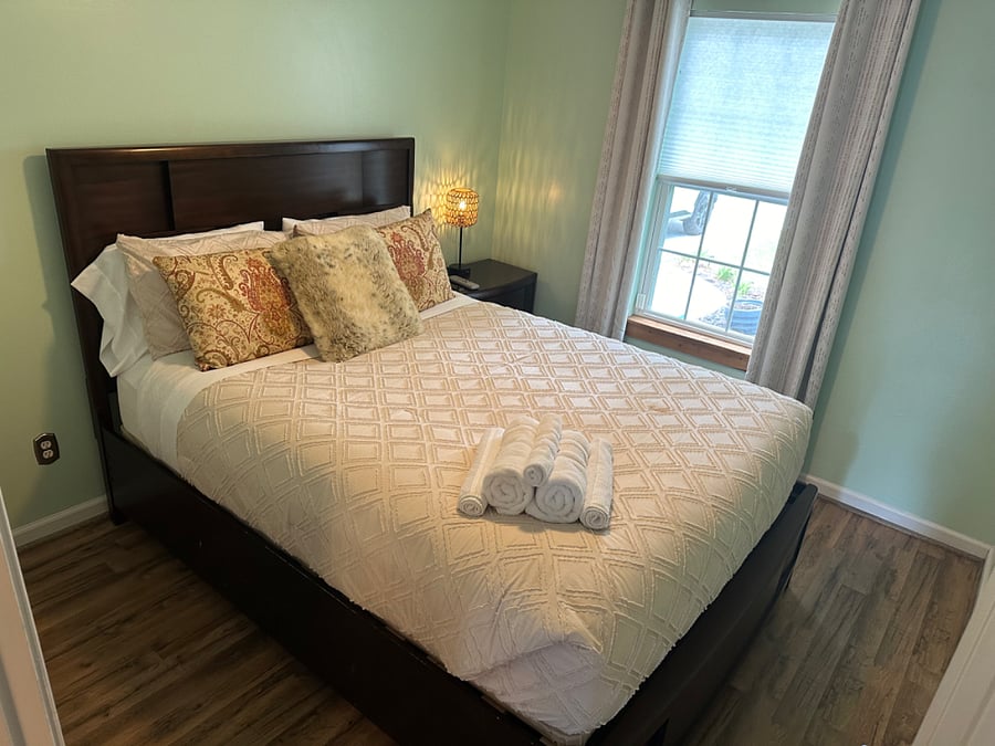 Second bedroom with queen bed and TV
