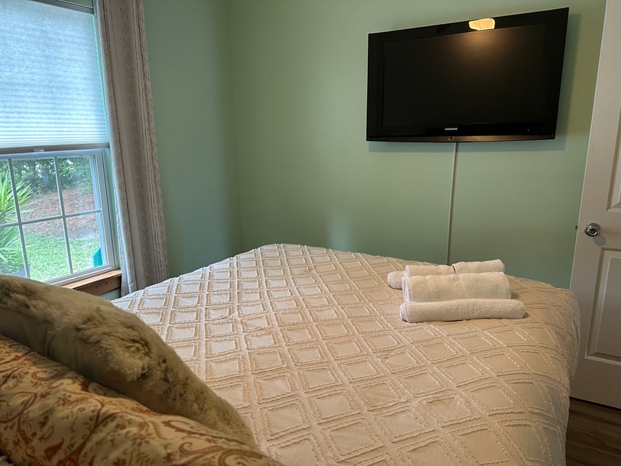 Second bedroom with queen bed and TV